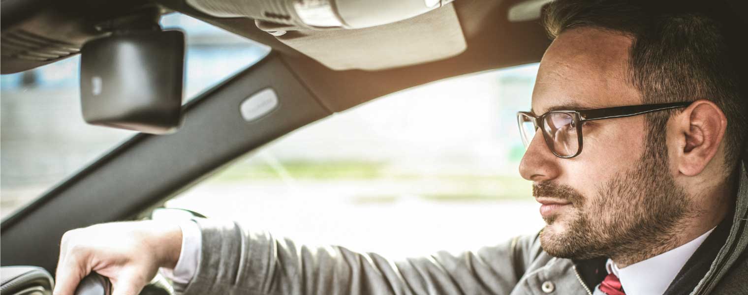 Man driving wearing drivewear lenses