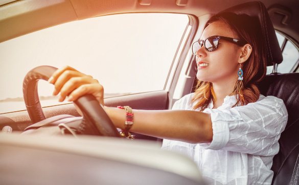 Woman driving wearing sun polarised lenses